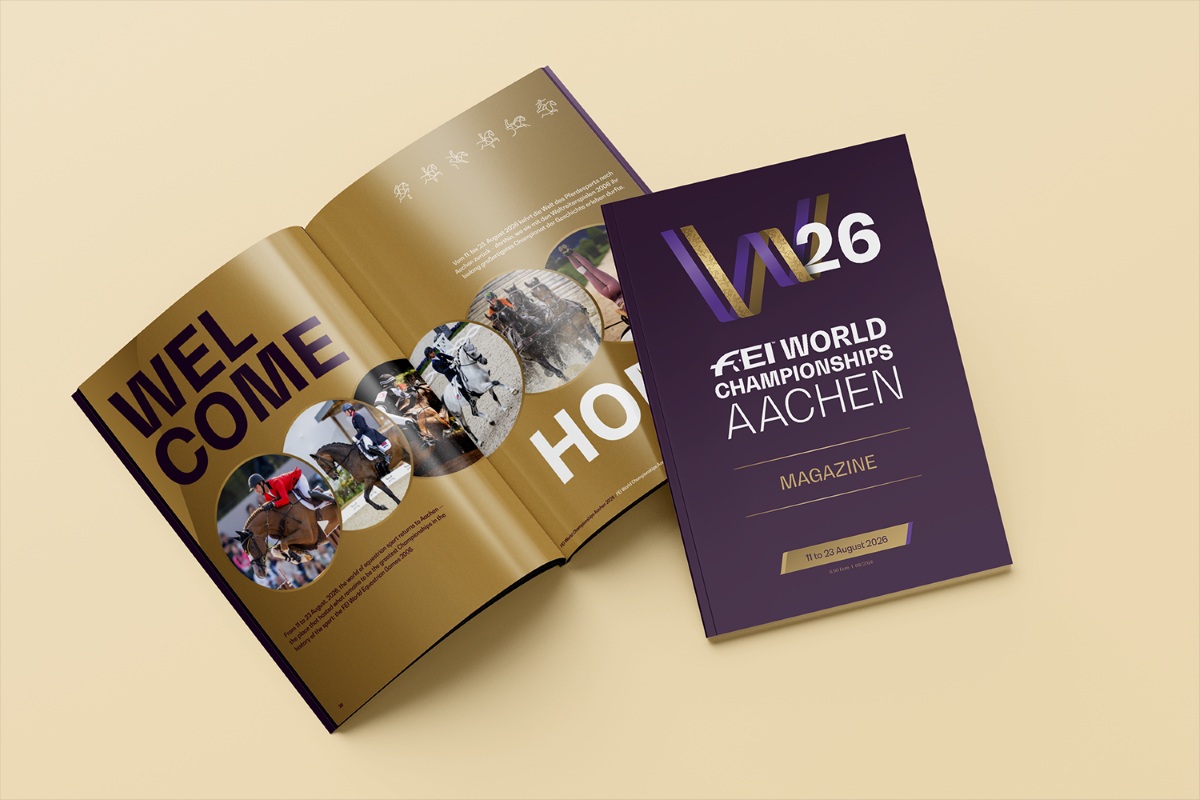 Illustration from a magazine about the FEI World Championships Aachen 2026: on the left is an open magazine featuring the headline ‘WELCOME HOME’ and equestrian photos; on the right is the cover with the ‘W26’ logo, the title ‘FEI World Championships Aachen – Magazine’ and the date ‘11 to 23 August 2026’.